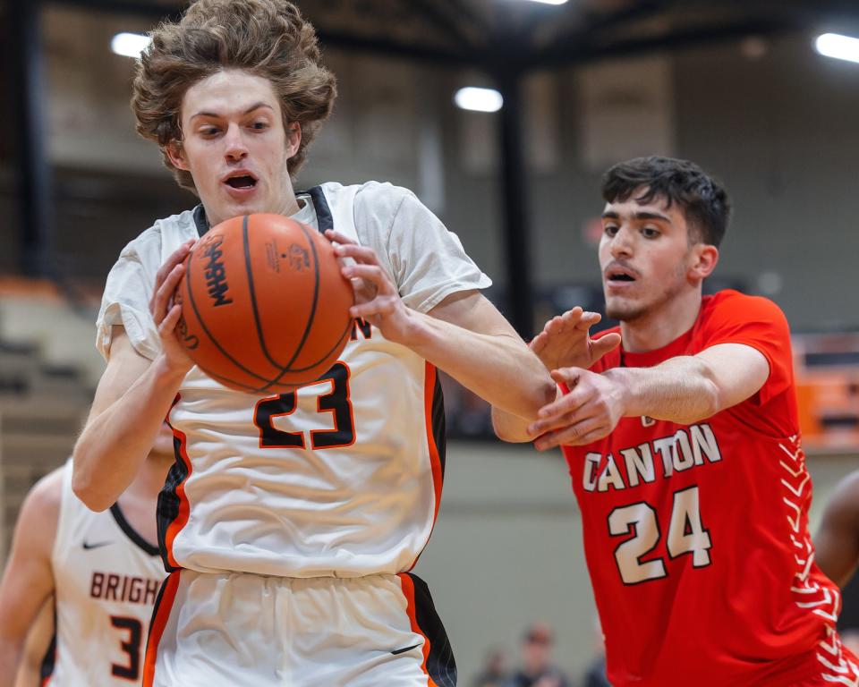 Brighton's Eddie Millington beats Canton's Omar Suleiman to the ball during the Bulldogs' 69-52 victory Tuesday, Jan. 24, 2023.