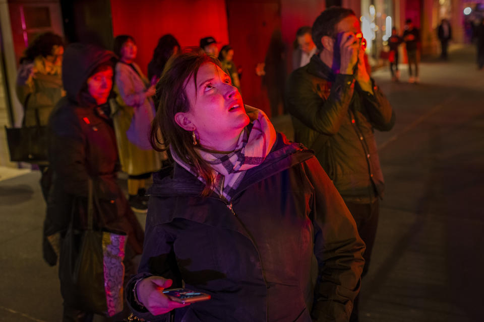 <p>People look at Trump Tower after a fire in the building in New York, Saturday, April 7, 2018. (Photo: Andres Kudacki/AP) </p>