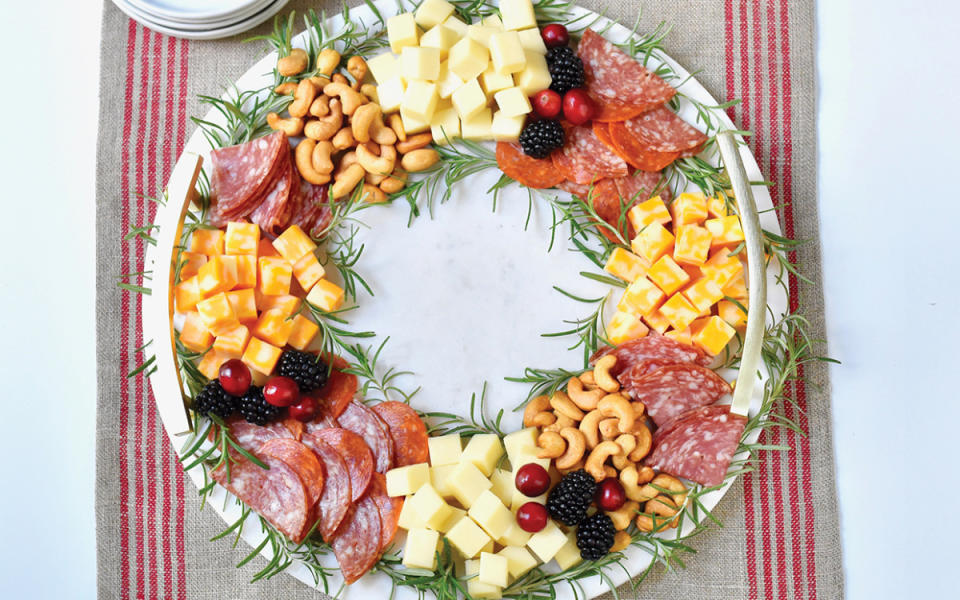 <p>Teresa Blackburn</p><p>This charming snack board is filled with all the ingredients people love to nibble on at <a href="https://parade.com/958103/pipandebby/best-slider-recipes-for-holiday-parties/" rel="nofollow noopener" target="_blank" data-ylk="slk:holiday parties;elm:context_link;itc:0;sec:content-canvas" class="link ">holiday parties</a>. All you need are roasted nuts, a variety of cheeses, sliced meats, fruits and veggies, then form a wreath shape on a round cutting board or <a href="https://www.yahoo.com/lifestyle/27-epic-thanksgiving-charcuterie-boards-165003070.html" data-ylk="slk:cheese board;elm:context_link;itc:0;sec:content-canvas;outcm:mb_qualified_link;_E:mb_qualified_link;ct:story;" class="link  yahoo-link">cheese board</a>.</p><p><strong>Get the Recipe: </strong><strong><a href="https://parade.com/1309081/parade/edible-holiday-wreath/" rel="nofollow noopener" target="_blank" data-ylk="slk:Edible Holiday Wreath;elm:context_link;itc:0;sec:content-canvas" class="link ">Edible Holiday Wreath</a></strong></p>