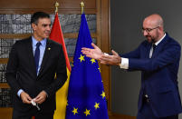European Council President Charles Michel, right, greets Spain's Prime Minister Pedro Sanchez ahead of a meeting on the sidelines of an EU summit at the European Council building in Brussels, Thursday, Oct. 1, 2020. European Union leaders are meeting to address a series of foreign affairs issues ranging from Belarus to Turkey and tensions in the eastern Mediterranean. (John Thys, Pool via AP)