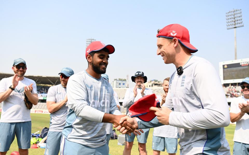 The debutant Rehan Ahmed is presented with his England T20 cap by Jos Buttler - Gareth Copley/Getty Images