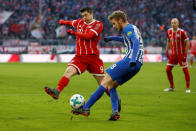 Soccer Football - Bundesliga - Bayern Munich vs Hertha BSC - Allianz Arena, Munich, Germany - February 24, 2018 Hertha Berlin’s Fabian Lustenberger in action with Bayern Munich's Robert Lewandowski REUTERS/Michaela Rehle