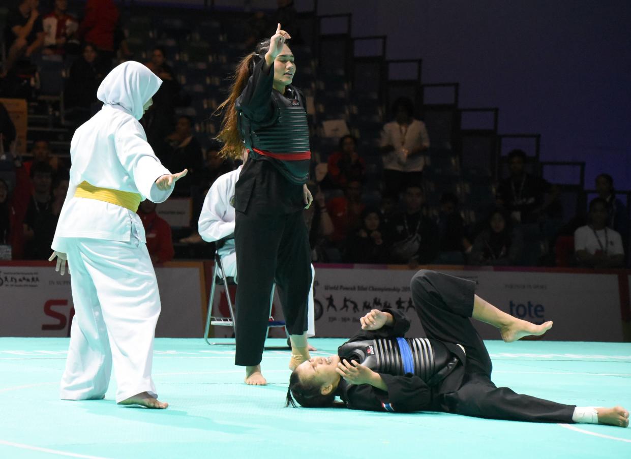 Singapore’s Nurul Suhaila Mohd Saiful claimedher first world title after having defeated her opponent Janejira Wankrue from Thailand in Class D (60-65kg)with a score of 5-0. (PHOTO: Singapore Silat Federation)