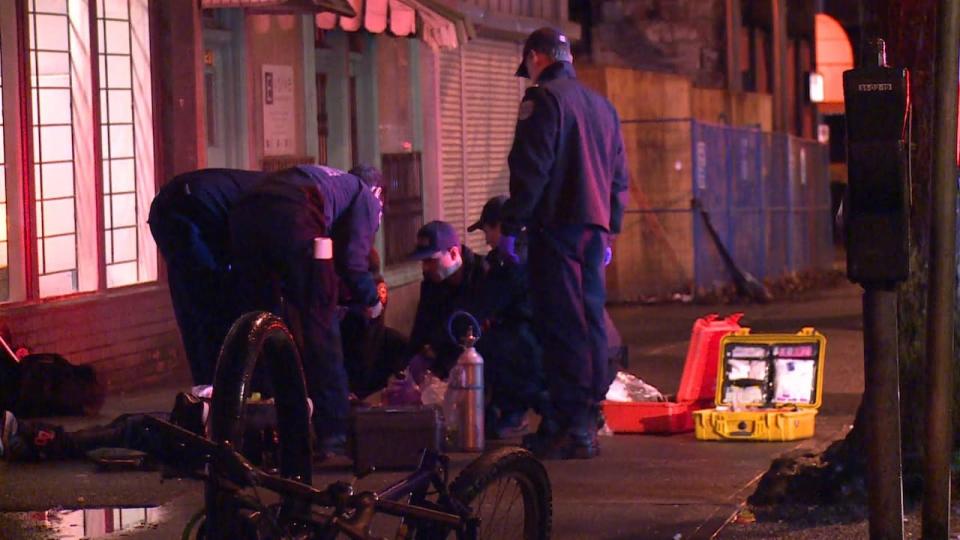 First responders surround an overdose victim on Vancouver's Downtown Eastside. Yesterday, the Vancouver Police confirmed it detected the deadly opioid carfentanil — a drug 100 times more potent than fentanyl — in a recent drug seizure.