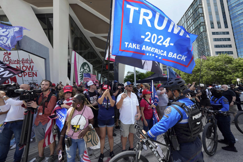FILE - Police line the street as former President Donald Trump departs the Wilkie D. Ferguson Jr. U.S. Courthouse, Tuesday, June 13, 2023, in Miami. (AP Photo/Gerald Herbert, File)