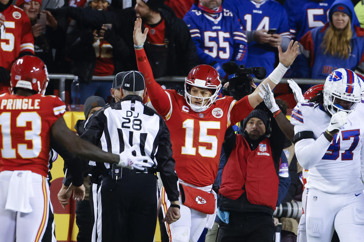 Kansas City Chiefs quarterback Patrick Mahomes (15) reacts after scoring on an 8-yard touchdown run during the first half of an NFL divisional round playoff football game against the Buffalo Bills, Sunday, Jan. 23, 2022, in Kansas City, Mo. (AP Photo/Colin E. Braley)
