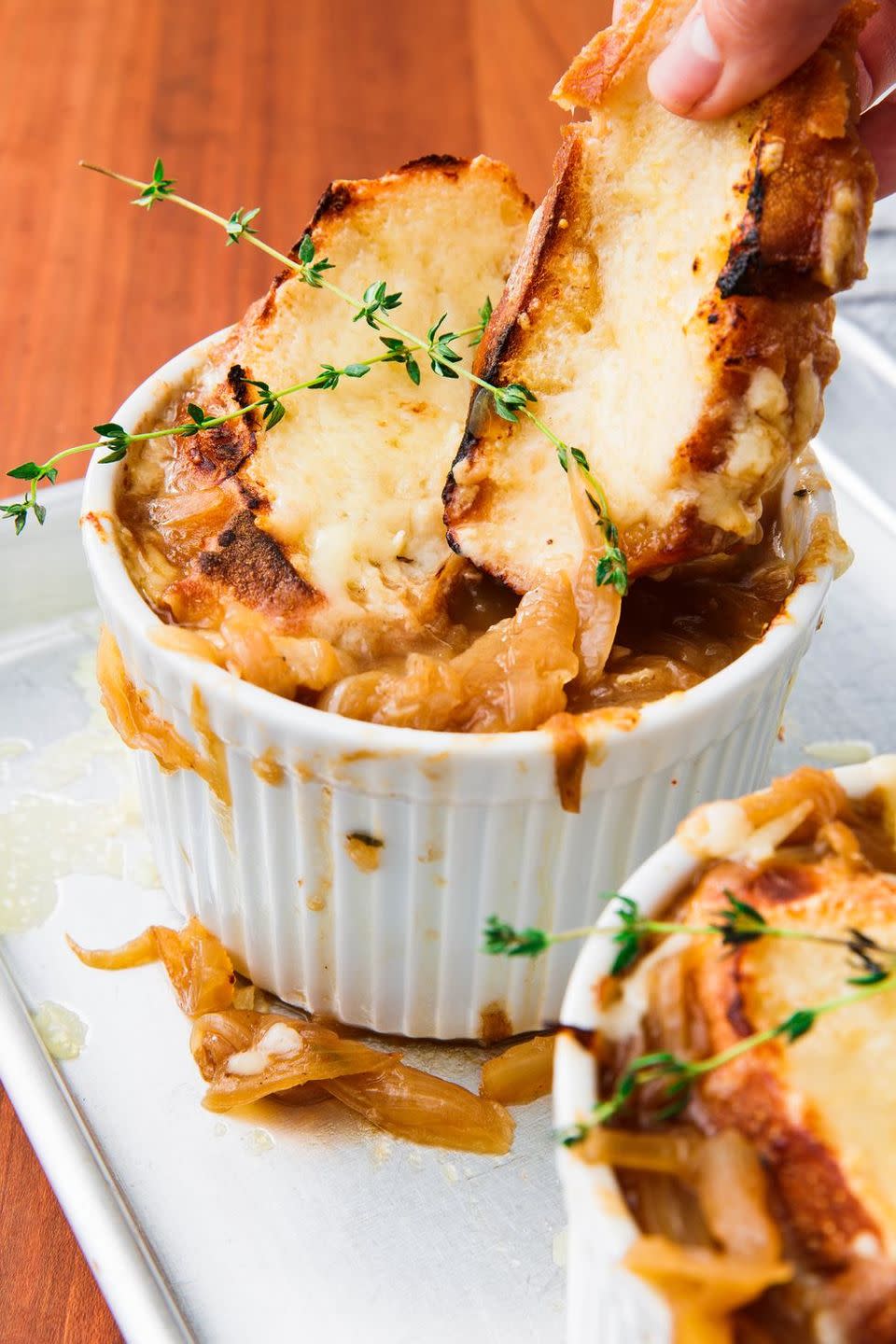 <p>We like ladling the soups into ramekins, topping each serving with bread, and melting the cheese right on top of the soup, under the grill. The top gets super crispy and bubbly, and the bottom softens slightly, making it easy to dig into. </p><p>Get the <a href="https://www.delish.com/uk/cooking/recipes/a31012320/easy-french-onion-soup-recipe/" rel="nofollow noopener" target="_blank" data-ylk="slk:French Onion Soup;elm:context_link;itc:0;sec:content-canvas" class="link ">French Onion Soup</a> recipe.</p>