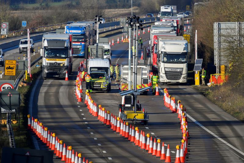 FILE PHOTO: Freight lorries are stopped to undergo checks on the M20 motorway