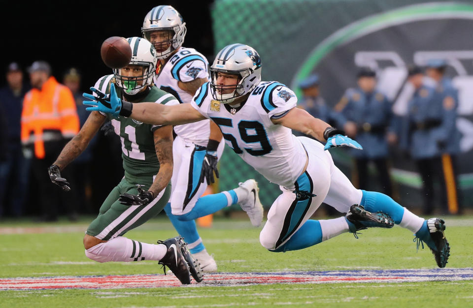 <p>Luke Kuechly #59 of the Carolina Panthers attempts to deflect a pass intended for wide receiver Robby Anderson #11 of the New York Jets during the second half of the game at MetLife Stadium on November 26, 2017 in East Rutherford, New Jersey. (Photo by Abbie Parr/Getty Images) </p>