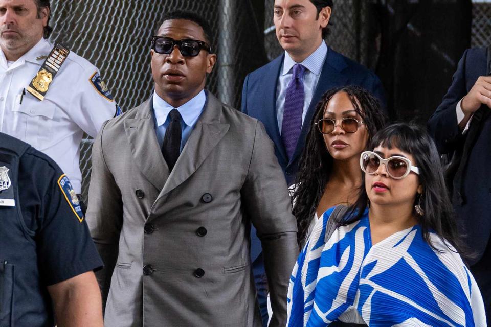 <p>Alexi Rosenfeld/Getty Images</p> Jonathan Majors and his girlfriend Meagan Good, flanked by his lawyer Priya Chaudhry