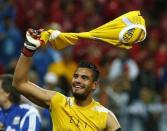 Argentina's goalkeeper Sergio Romero celebrates winning their 2014 World Cup semi-finals against the Netherlands at the Corinthians arena in Sao Paulo July 9, 2014. REUTERS/Michael Dalder