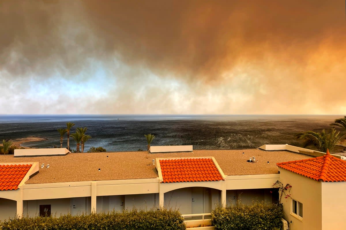 Smoke is seen from the Rodos Princess Beach Hotel on the Aegean Sea Island of Rhodes (AP Photo/Ian Murison)