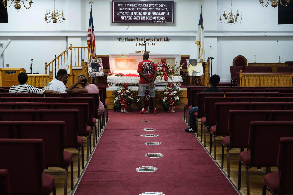 James Floyd, Jamel Floyd’s father, looks over his son's body during the wake at Judea United Baptist Church in Hempstead, N.Y., on June 29.<span class="copyright">Yuki Iwamura</span>