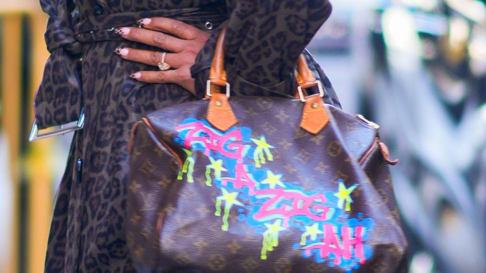  A close up of Mel B's Louis Vuitton bag and leopard print manicure 