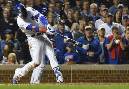 Jun 19, 2018; Chicago, IL, USA; Chicago Cubs center fielder Albert Almora Jr. (5) hits a game winning RBI single off of Los Angeles Dodgers relief pitcher Brock Stewart (48) in the tenth inning in the second game of a baseball doubleheader at Wrigley Field. Mandatory Credit: Matt Marton-USA TODAY Sports