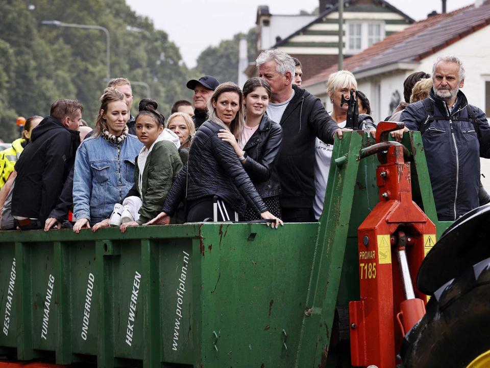 People are evacuated from their homes in South Limburg, the Netherlands, by the fire brigade (EPA)