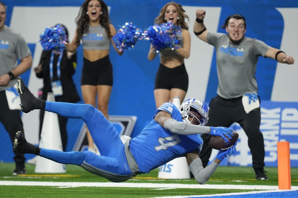 Detroit Lions' DJ Chark dives into the end zone for a touchdown reception during the first half of an NFL football game against the Minnesota Vikings Sunday, Dec. 11, 2022, in Detroit. (AP Photo/Paul Sancya)