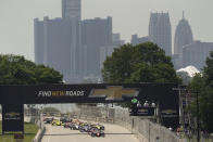 Pole sitter Pato O'Ward leads the field to the start line during the first race of the IndyCar Detroit Grand Prix auto racing doubleheader on Belle Isle in Detroit Saturday, June 12, 2021. (AP Photo/Paul Sancya)