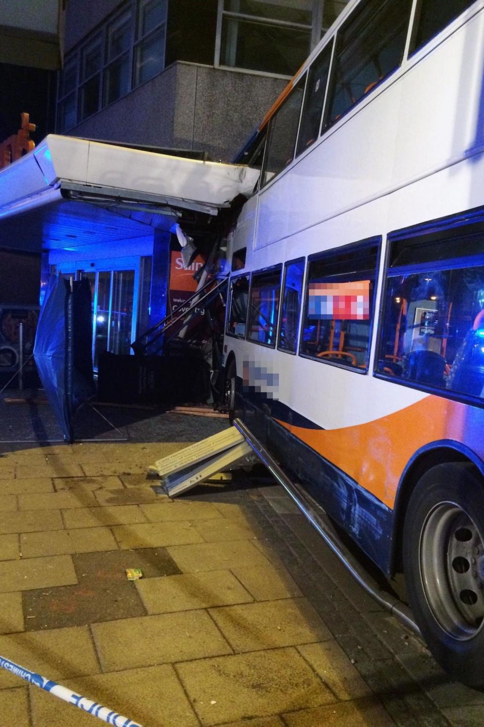 The scene after the bus smashed into the Sainsbury's in Coventry (PA)