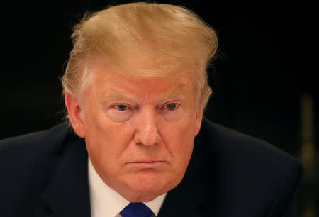 FILE PHOTO: U.S. President Donald Trump participates in an American Workforce Policy Advisory Board meeting in the White House State Dining Room in Washington, U.S., March 6, 2019. REUTERS/Leah Millis/File Photo