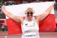 <p>Poland's Anita Wlodarczyk wears Olympic-themed glasses to celebrate winning gold in the Women's Hammer Throw Final at Olympic Stadium on August 3.</p>