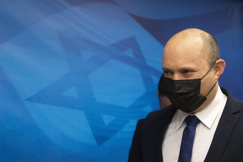 Israeli Prime Minister Naftali Bennett arrives for the weekly cabinet meeting at the Prime Minister's office in Jerusalem, Sunday, Sept. 5, 2021. (AP Photo/Sebastian Scheiner, Pool)