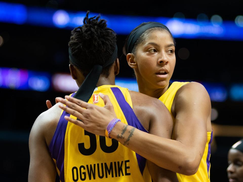Candace Parker (right) pats Nneka Ogwumike on the back.