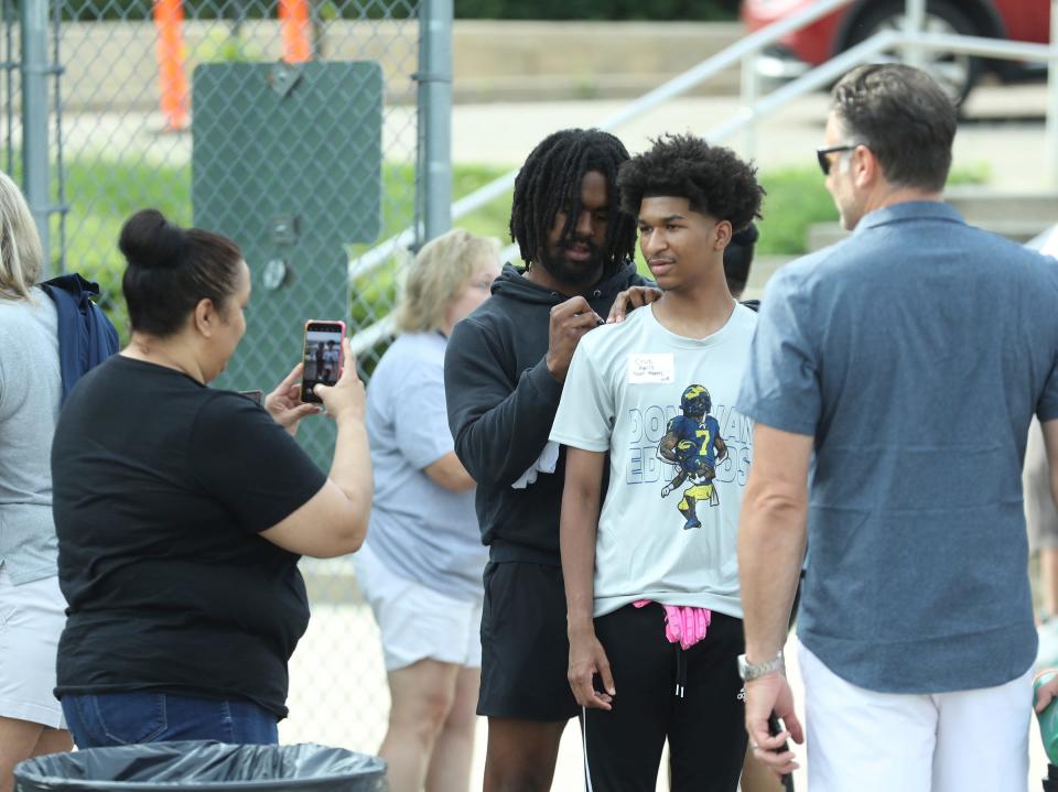Michigan running back Donovan Edwards signed autographs with participants before his football camp Saturday, July 1, 2023, at West Bloomfield High School.