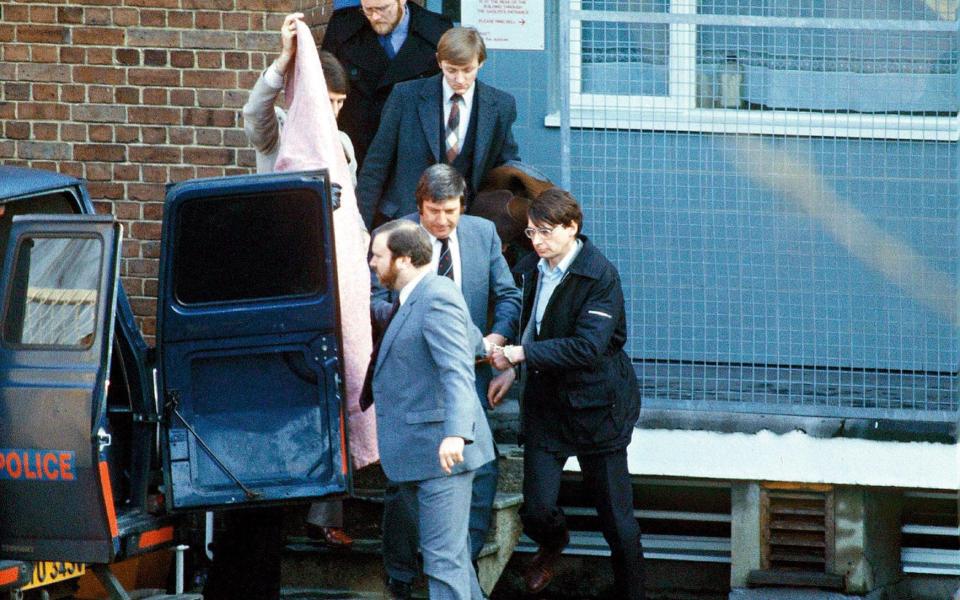 Nilsen being escorted from Highgate police station to court, following his arrest in February 1983 - Getty Images