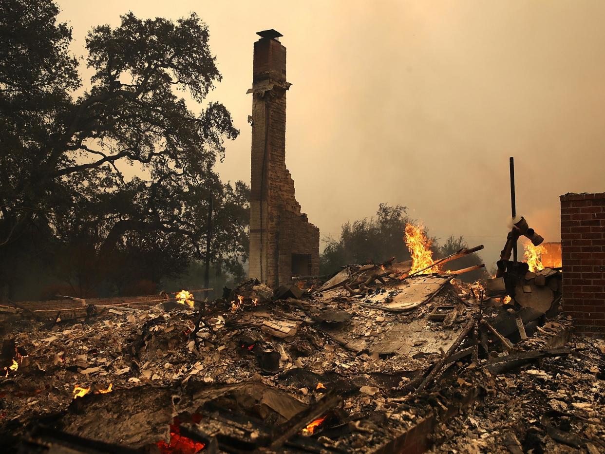 The remains of fire damaged homes after an out of control wildfire moved through the area in California: Justin Sullivan/Getty