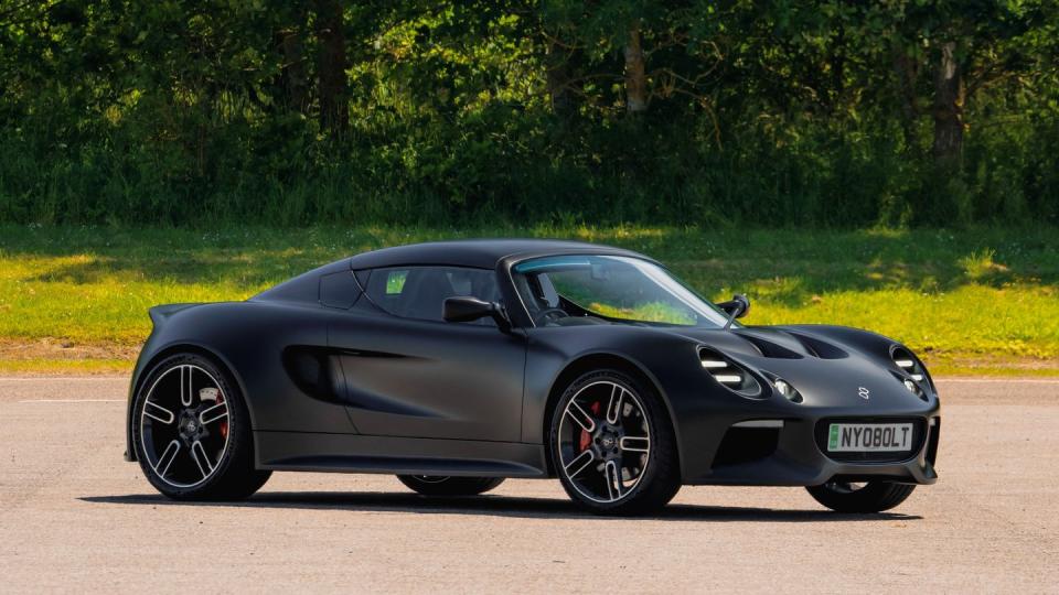 a black sports car on a road