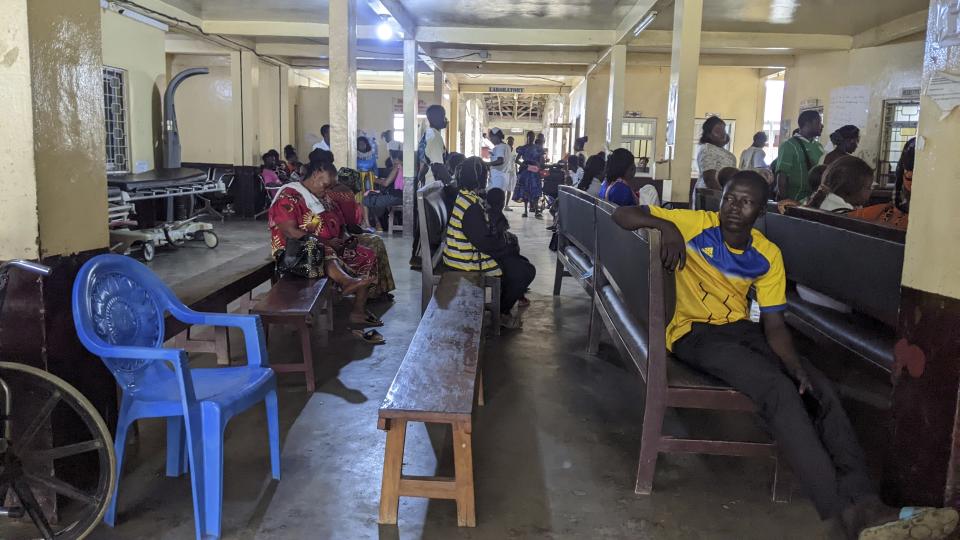 Patients sit in the waiting room of Mbingo Baptist Hospital in Mutengene, Cameroon, Tuesday May 21, 2024. The state of health care in Cameroon is a source of growing concern, with thousands of doctors and nurses leaving the country for better paying jobs in Canada. While the central African country has one of the lowest number of health workers per capita in the world, salaries and recruitment in the medical field remains extremely low. (AP Photo/Angel Ngwe)