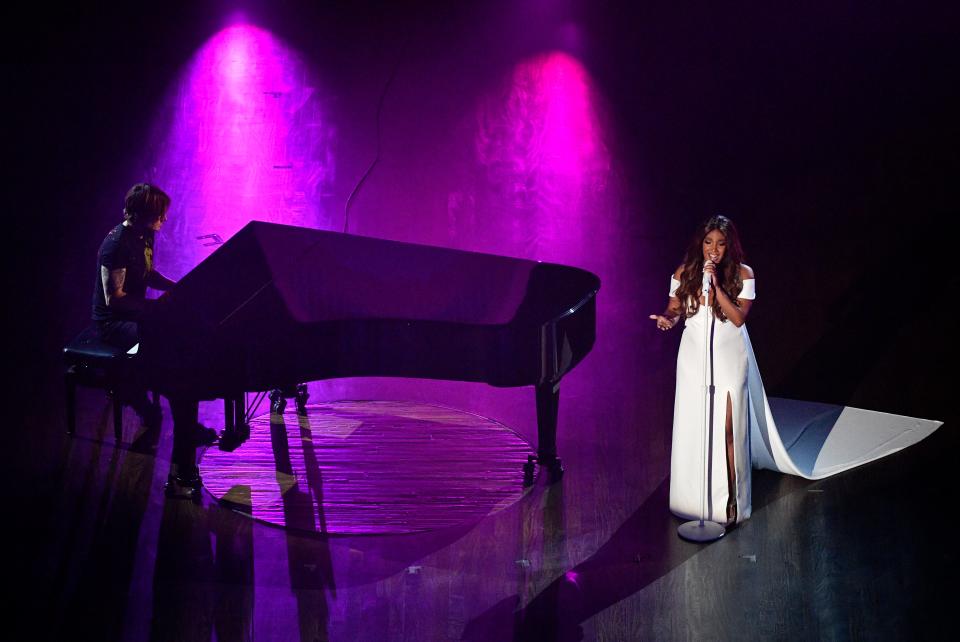 Keith Urban accompanies Mickey Guyton as she sings during the 55th Academy of Country Music Awards at the Grand Ole Opry Wednesday, Sept. 16, 2020 in Nashville, Tenn. 