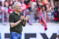 Freiburg's head coach Christian Streich applauds during German Bundesliga soccer match between SC Freiburg and 1. FC Heidenheim in Freiburg, Germany, Saturday, May 11, 2024. (Tom Weller/dpa via AP)