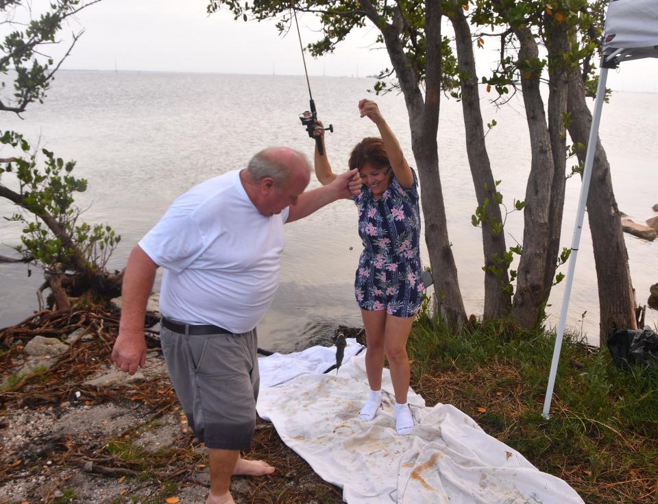 Russell and  Gladia LaFontaine from Deltona set up a little canopy and fishing until launch, parked next to the Beachline.  People started showing up at dawn to view  the launch of the  SpaceX Crew Dragon to the International Space Station.