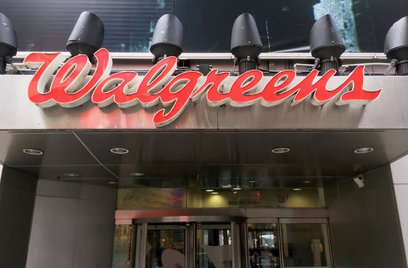 FILE PHOTO: The Walgreens logo is seen outside the store in Times Square in New York