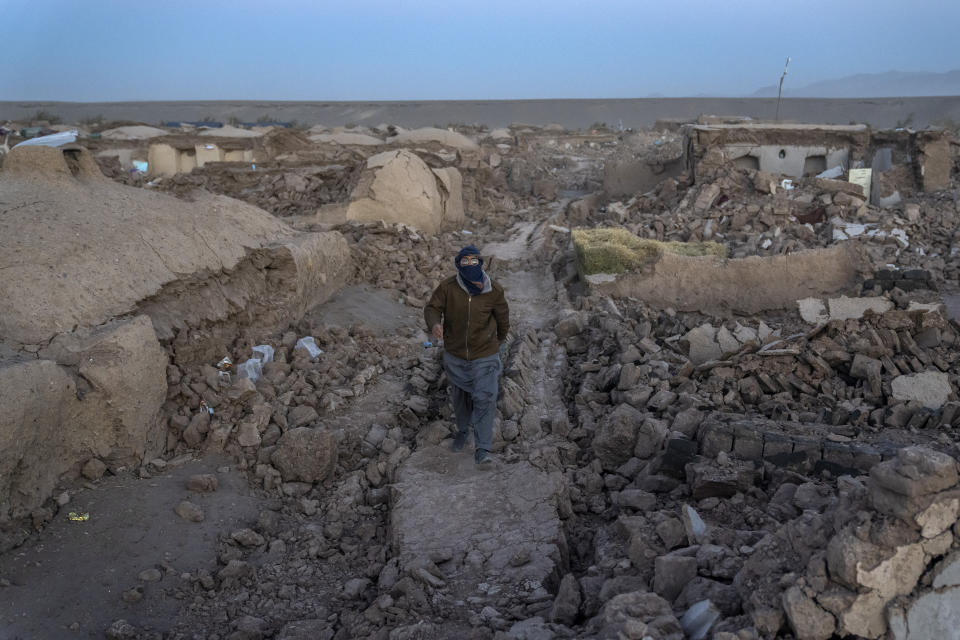 An Afghan man searches for victims after an earthquake in Zenda Jan district in Herat province, of western Afghanistan, Sunday, Oct. 8, 2023. Powerful earthquakes killed at least 2,000 people in western Afghanistan, a Taliban government spokesman said Sunday. It's one of the deadliest earthquakes to strike the country in two decades. (AP Photo/Ebrahim Noroozi)