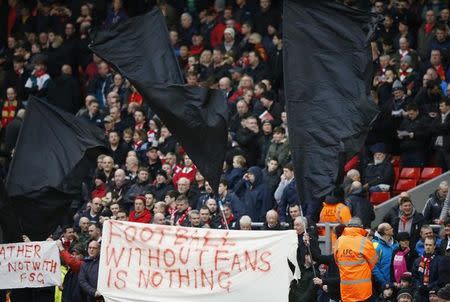 Football Soccer - Liverpool v Sunderland - Barclays Premier League - Anfield - 6/2/16 Liverpool fans hold up signs in protest against ticket prices Reuters / Phil Noble/ Livepic