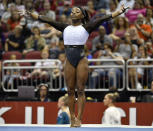 Simone Biles begins her floor exercise routine during the GK US Classic gymnastics meet in Louisville, Ky., Saturday, July 20, 2019. (AP Photo/Timothy D. Easley)