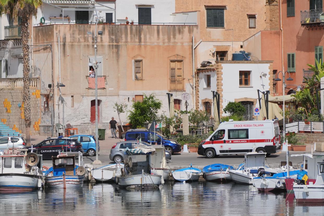 A police car escorts an ambulance carrying the fifth body recovered from Porticello Harbour, on the fourth day of the search for the six tourists missing after the luxury yacht Bayesian sank in a storm on Monday whilst moored around half a mile off Porticello on the Sicilian coast. The body of a fifth missing person has been recovered this morning, following the recovery of four others on Wednesday. Picture date: Thursday August 22, 2024.