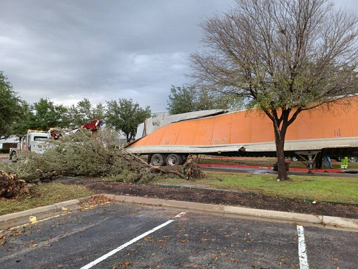 A probable tornado twisted a truck trailer in a parking lot between Walmart and Sam’s Club in Grapevine on Tuesday, Dec. 13, 2022.