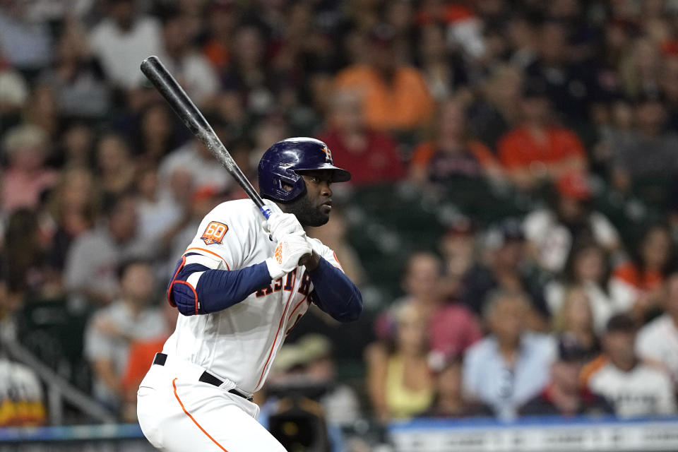 Houston Astros' Yordan Alvarez watches his single against the Minnesota Twins during the third inning of a baseball game Tuesday, Aug. 23, 2022, in Houston. (AP Photo/David J. Phillip)