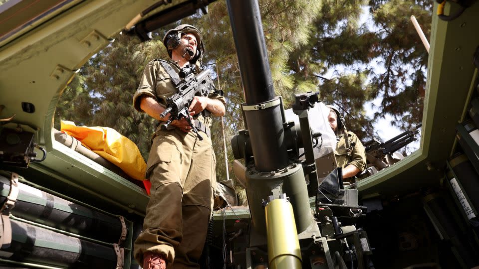 An Israeli soldier stands in an armoured vehicle near the Lebanon border on October 23, 2023, amid the ongoing battles between Israel and the Palestinian group Hamas. - Jalaa Marey/AFP/Getty Images