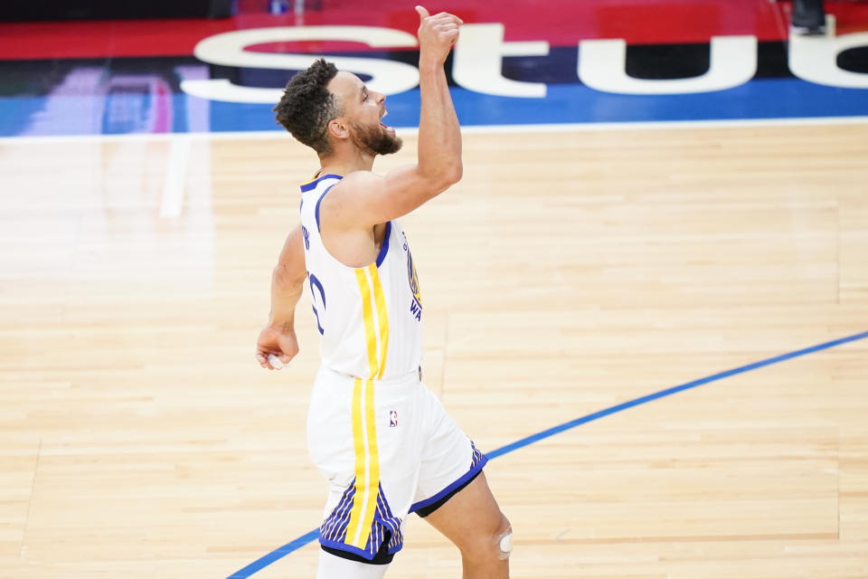 Golden State Warriors' Stephen Curry reacts after making a three-pointer during the second half of an NBA basketball game against the Philadelphia 76ers, Monday, April 19, 2021, in Philadelphia. (AP Photo/Matt Slocum)