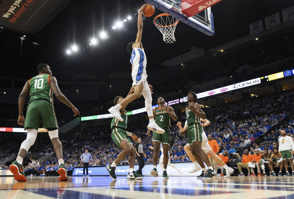 Creighton's Trey Alexander (23) dunks over Florida A&M's Chase Barrs (10), Roderick Coffee III (11), Jordan Chatman (2) and Ja'Derryus Eatmon (24) during the first half of an NCAA college basketball game on Tuesday, Nov. 7, 2023, in Omaha, Neb. (AP Photo/Rebecca S. Gratz)