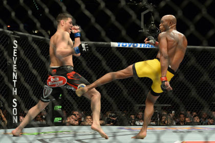 Anderson Silva lands a kick with his left leg, which was broken in his last fight against Chris Weidman. (USAT)