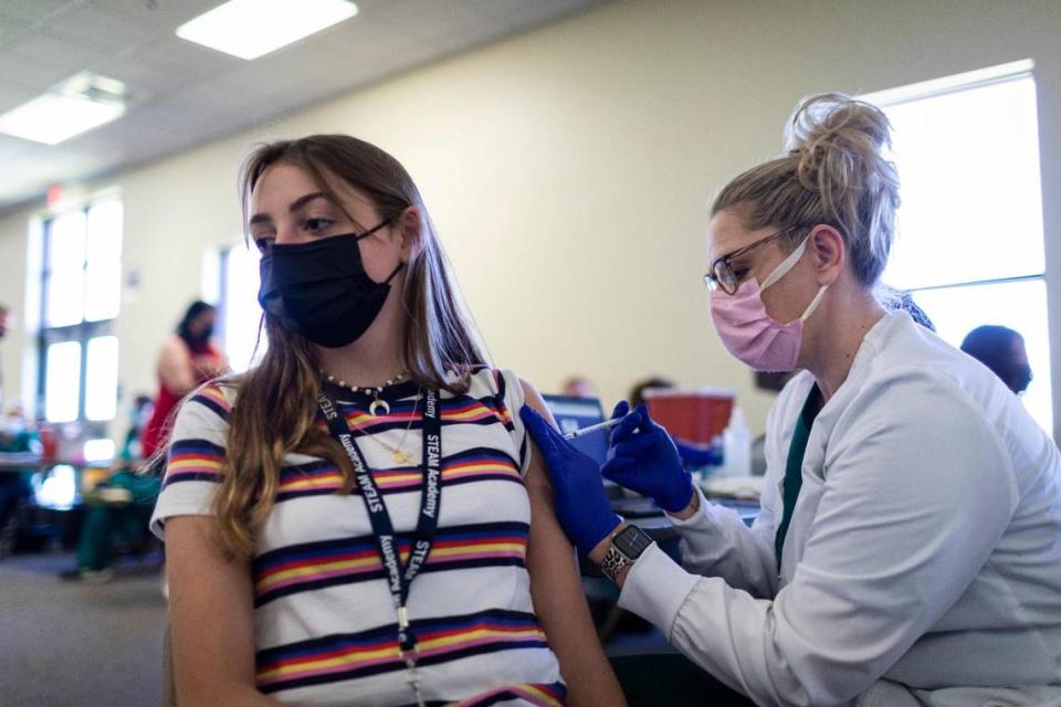 Samantha Schnelle, 15, receives her first COVID-19 vaccination shot at STEAM Academy in Lexington, Ky., Thursday, May 13, 2021. Close to 60 children 12 and up where scheduled to receive the vaccine at STEAM Academy today.