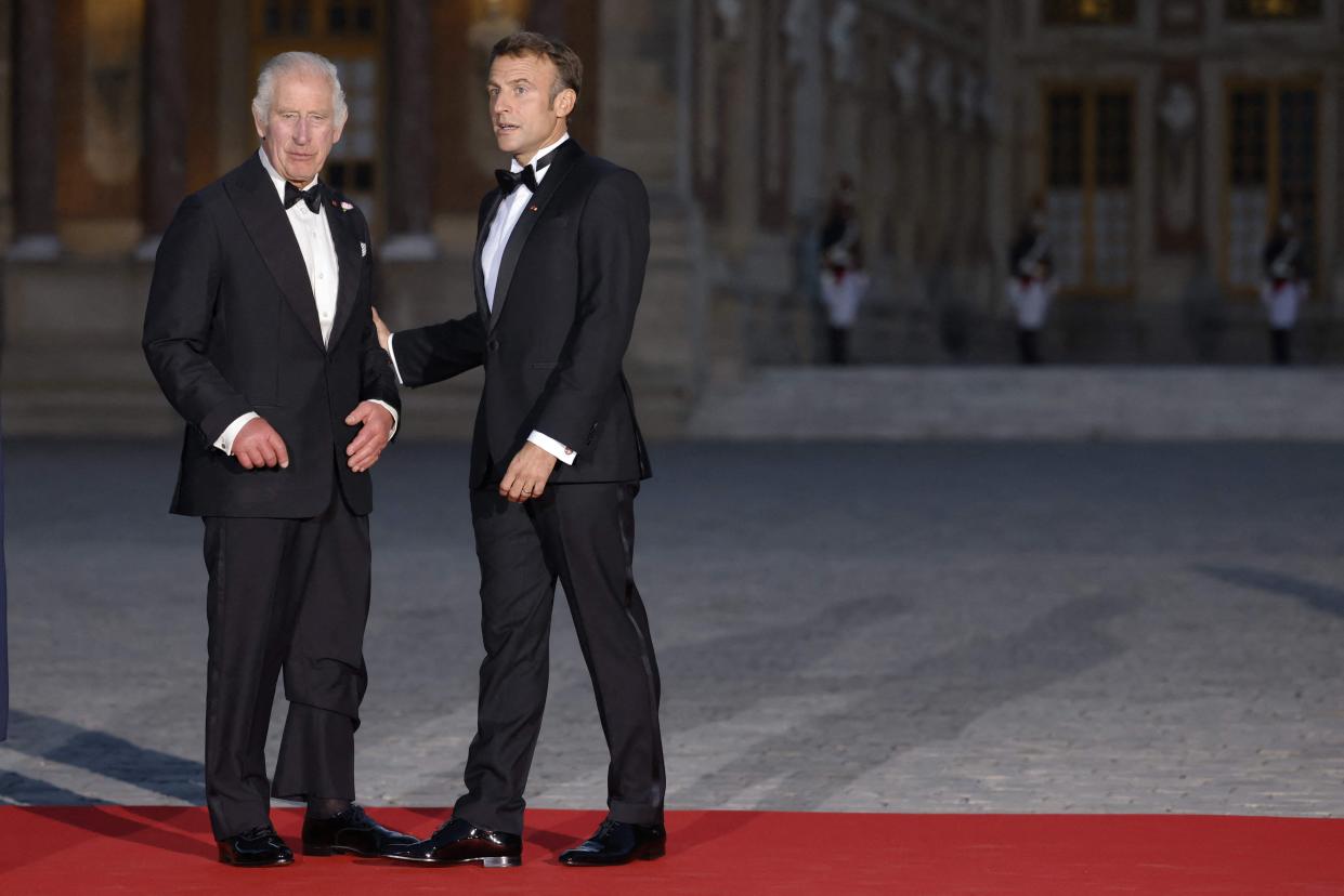 King Charles and Macron in black-tie for the lavish state dinner last night (AFP via Getty Images)