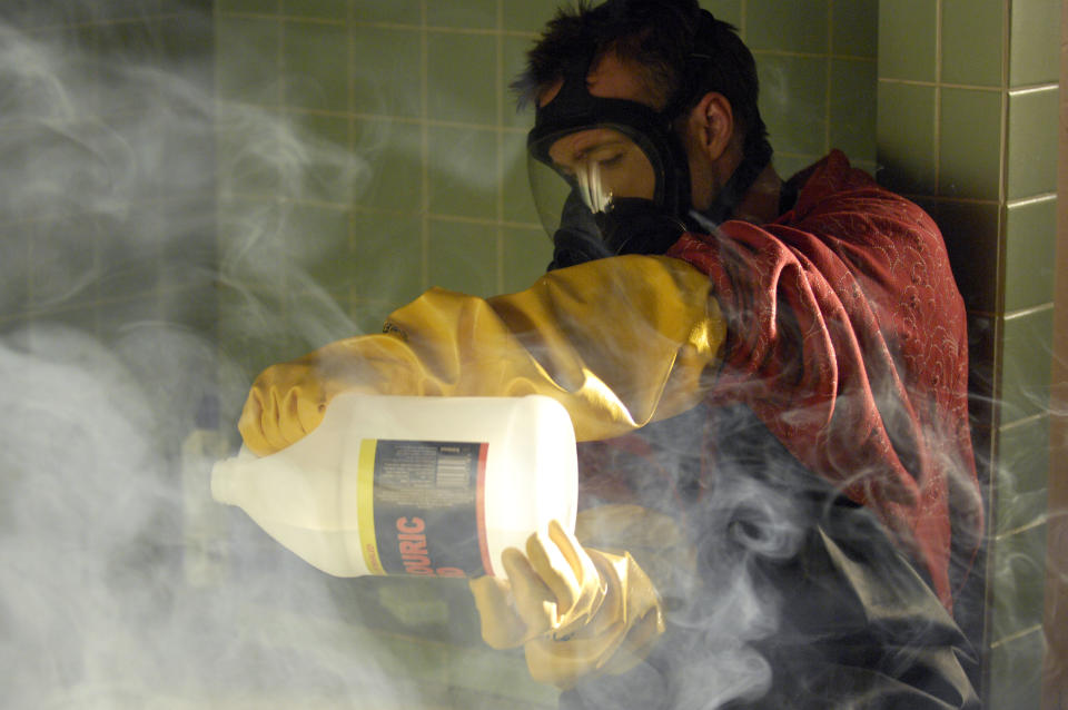 This image released by AMC shows Jesse Pinkman, played by Aaron Paul, using acid to dissolve the body of drug dealer Emilio Koyama in the pilot episode of "Breaking Bad." The series finale of the popular drama series aired on Sunday, Sept. 29.(AP Photo/AMC, Lewis Jacobs)