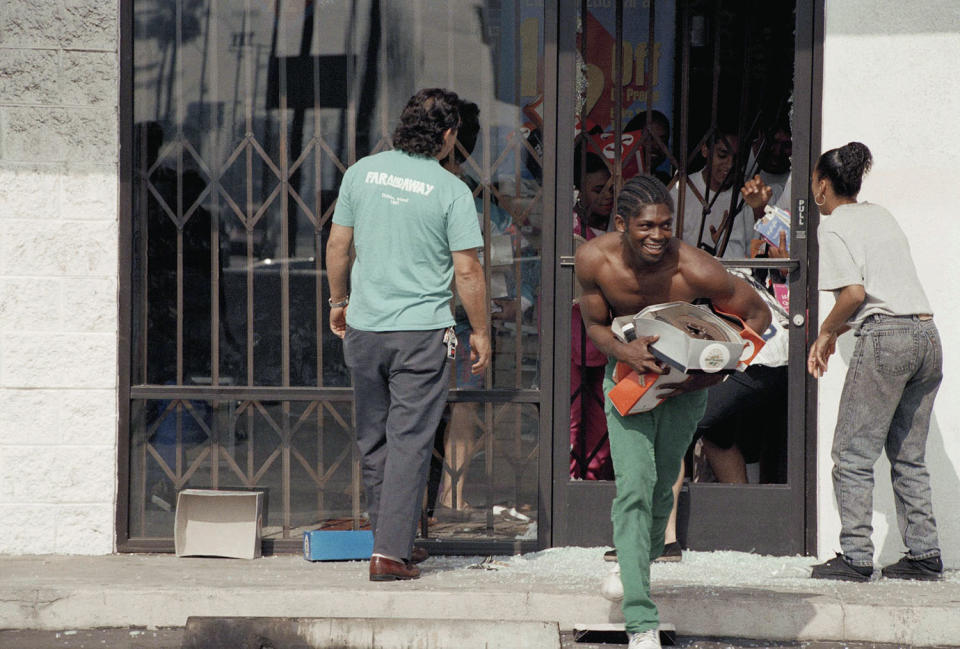 Looter running out of store